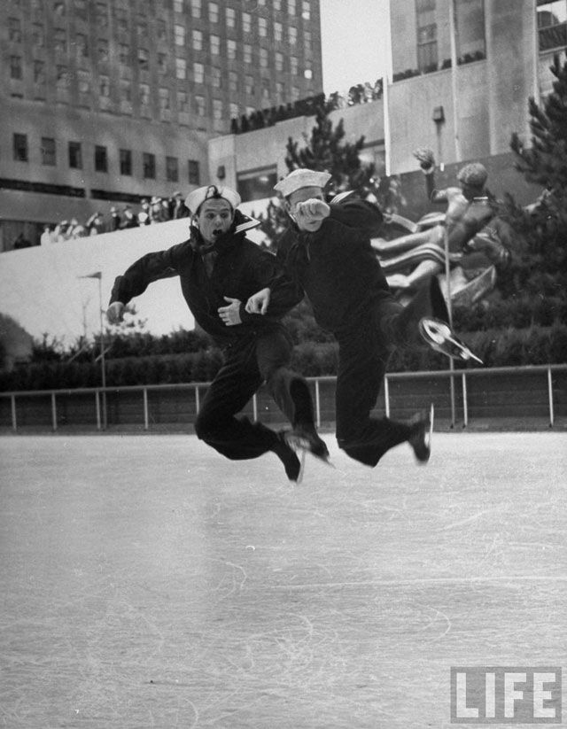 1942. Two US sailors skating on the ice rink at Rockefeller Center.